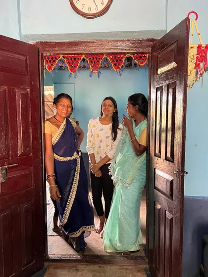 Sharing a laugh in the doorway of a village home. These candid moments of connection and cultural exchange are what make our cycling holidays so special.