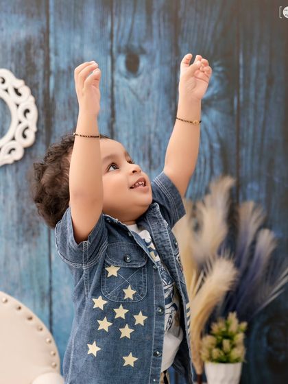 A moment of pure, unscripted joy as this little boy reaches for the sky. These are the candid shots I love to capture.