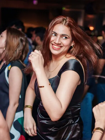 A guest with a huge smile, dancing the night away at Kaze.