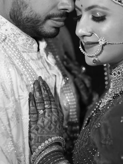 An intimate black and white moment. You can see the beautiful details of her makeup and henna even without color.