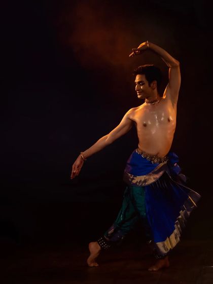 A graceful, flowing movement captured during the Samarpan Festival. This pose shows the elegance and fluidity that complements the more energetic aspects of Kuchipudi.