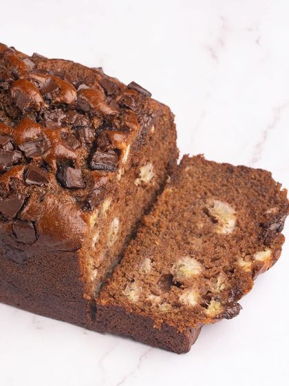 A classic comfort bake, our chocolate banana bread is rich, moist, and loaded with chocolate chunks.
