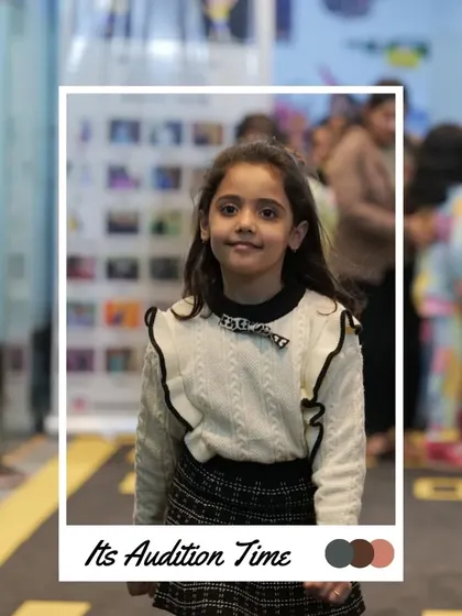 A sweet smile from this participant as she waits for her turn. The audition process is a great way to meet other kids who love fashion.