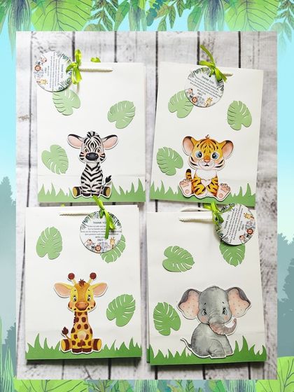 A set of four jungle-themed paper bags, each highlighting a different animal: zebra, tiger, giraffe, and elephant. The 3D effect of the cutouts makes them stand out.