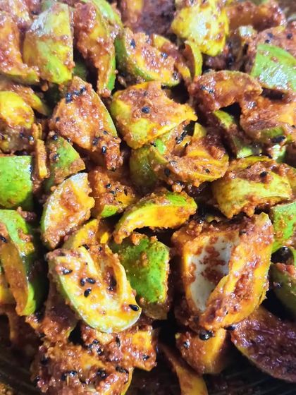 This is what my mango pickle looks like right after it's mixed. You can see the pieces of raw mango and the texture of the freshly ground spices.