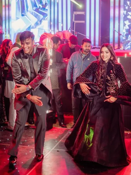 Siblings bringing their A-game to the sangeet dance floor.