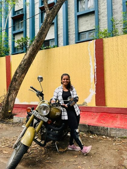 A graduate looking happy and relaxed on her bike. She has mastered the skills and is now enjoying the freedom of the ride.