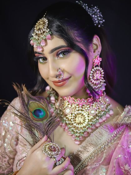 A close-up of the final look, showing the beautiful blend of colors in the eye makeup and the delicate nose ring.