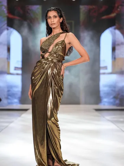 A glamorous, bronzed makeup look created for The Luxo Show. The glowing skin and smokey eye perfectly match this metallic gold gown.