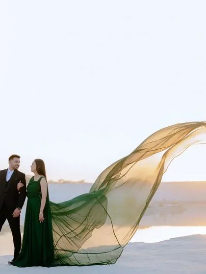 This wide-angle shot shows the scale of the landscape and the beauty of the flowing gown. It’s a great example of the epic, cinematic style I bring to my pre-wedding photography.