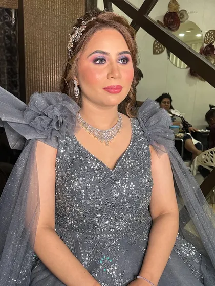 My engagement bride looking absolutely stunning in a grey gown. I created a look with dramatic eyes and a soft lip to match her glamorous outfit.