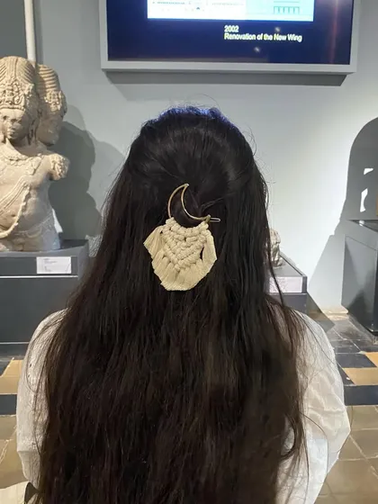 Another view of the macrame moon hair clip. The natural cotton cord and crescent moon shape create a beautiful, earthy accessory.