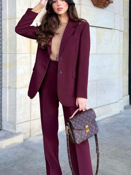 My power suits are perfect for looking stylish while on the go. This client is traveling in style with a custom-made maroon blazer and trouser set.