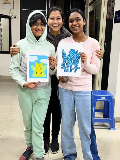 Our instructor with two happy students and their finished serigraph prints. It's a joy to guide them through the process.