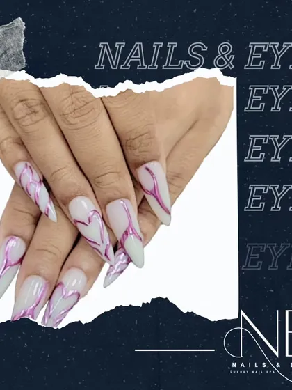 A promotional image featuring our dramatic, long stiletto nails with an abstract heart line design.