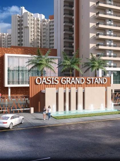 The entrance gate for the 'Oasis Grand Stand' housing project. The design incorporates a modern water feature and clean architectural lines, setting a contemporary tone for the entire community.