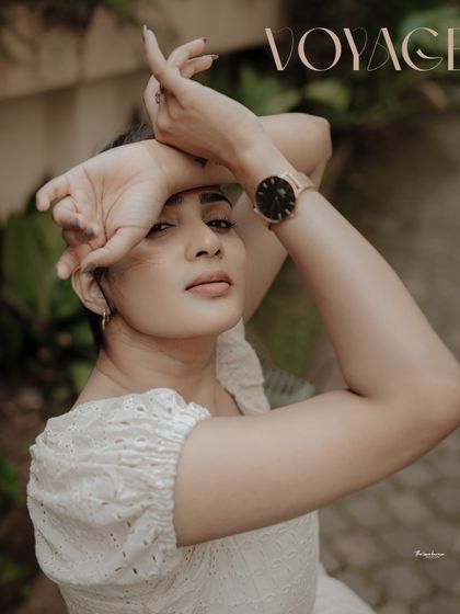 A high-fashion pose with a "Voyage" magazine-style text overlay. This image is designed to look like it's straight from an editorial spread.