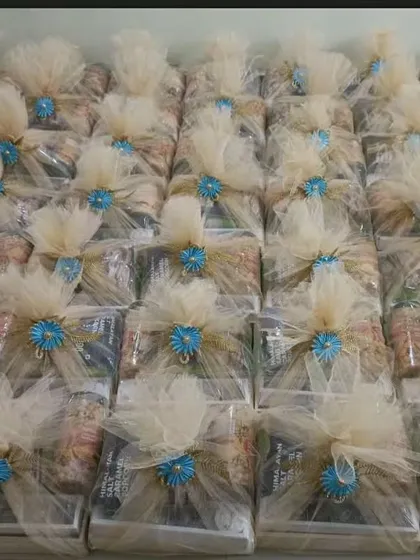 An overhead view of a large order of my signature welcome hampers. This demonstrates my ability to handle bulk orders for large weddings while maintaining a high standard of presentation.