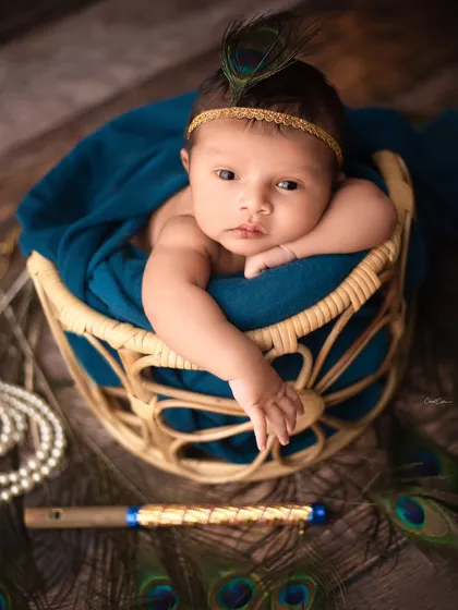 While I love sleepy poses, I also adore capturing a baby's bright, curious eyes when they are awake. This little one was so alert and calm for her Little Krishna themed portrait.