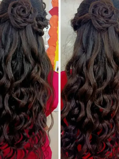 Advanced hairstyling is a key part of our cosmetology course. Here, a student has crafted an elegant half-updo with a detailed rose bun and long, flowing soft curls, a popular choice for receptions and parties.
