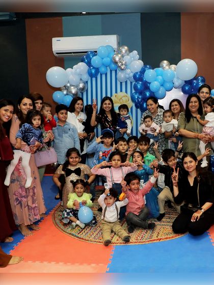 A fantastic group photo of all the kids and parents at the Cinderella party, capturing the joy of the shared celebration.
