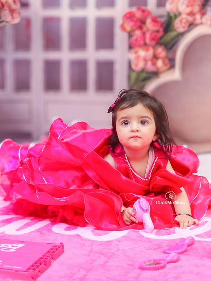 A quiet moment during a fun-filled Barbie session. Even the thoughtful expressions are precious memories to capture.