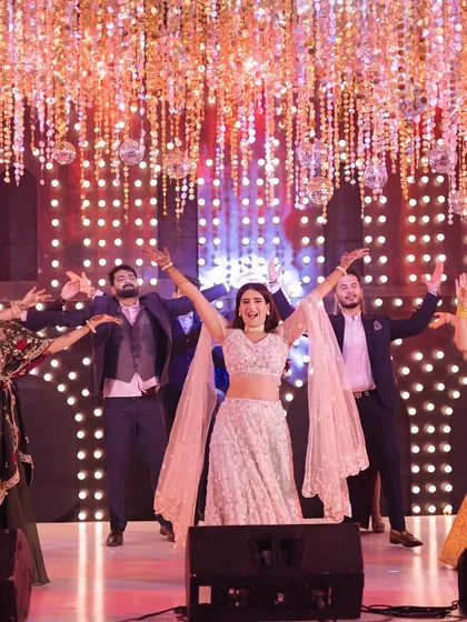 Look at that energy! This is what happens when the bride and her entire squad come together to own the stage. I love creating these full-scale group performances that get the whole crowd hyped.