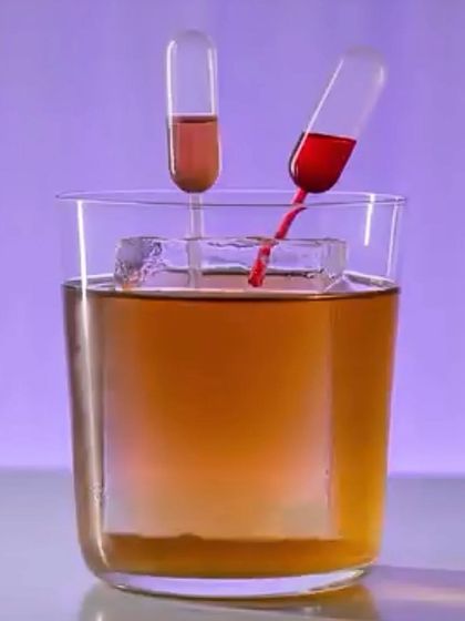 An interactive cocktail experience. This drink is served with pipettes containing different flavored syrups, allowing you to customize your drink.