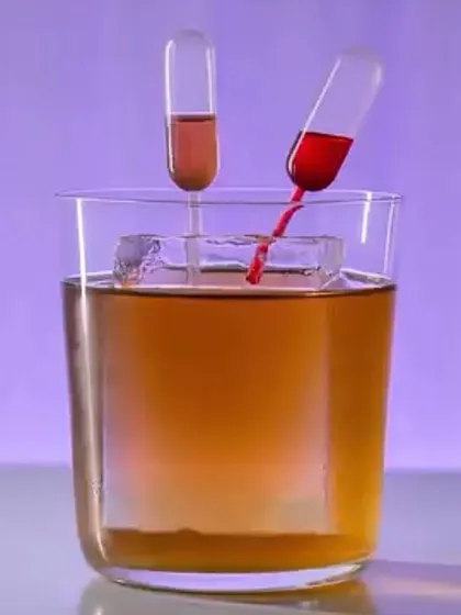 An interactive cocktail experience. This drink is served with pipettes containing different flavored syrups, allowing you to customize your drink.