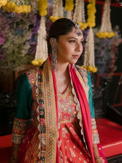 This bride-to-be nailed her mehendi look with our custom-designed colourful jewellery.