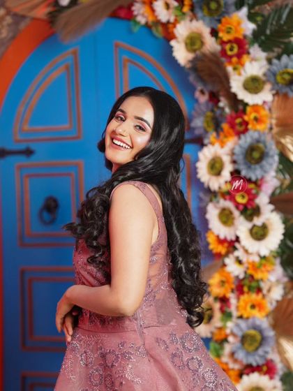 A fun, over-the-shoulder pose that shows off the beautiful hairstyle.