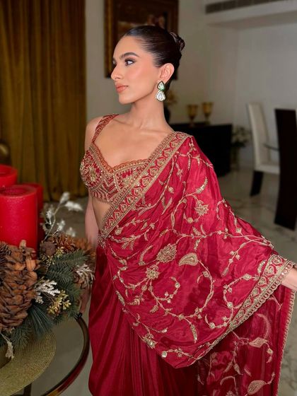 A little kajal, a little shimmer, and a whole lot of timeless beauty. This look in a red Torani saree is perfect for a festive occasion or a wedding event.