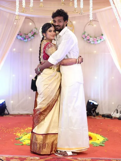 A sweet photo of the couple on stage, capturing a memory from their special day.