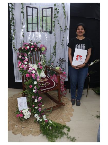For her final project, this student created a breathtaking floral cascade over a rocking chair. This piece demonstrates mastery of advanced techniques, structure, and creating a powerful visual narrative.