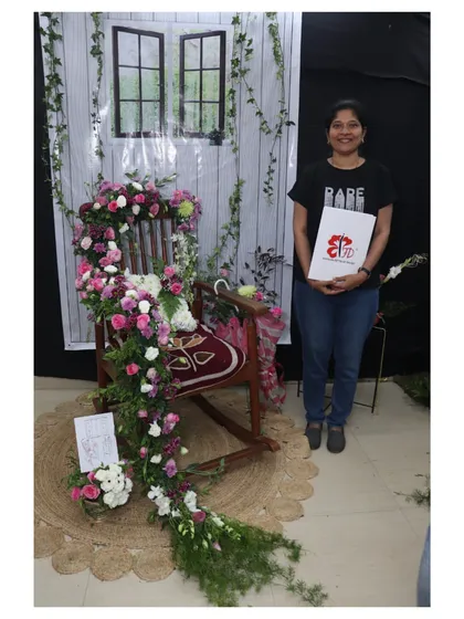 For her final project, this student created a breathtaking floral cascade over a rocking chair. This piece demonstrates mastery of advanced techniques, structure, and creating a powerful visual narrative.