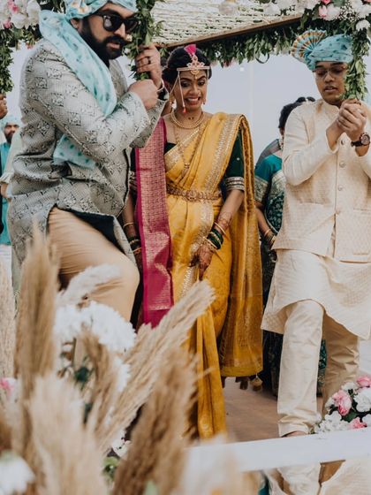 The bride's grand entrance, escorted by her brothers, a moment of family love and support.