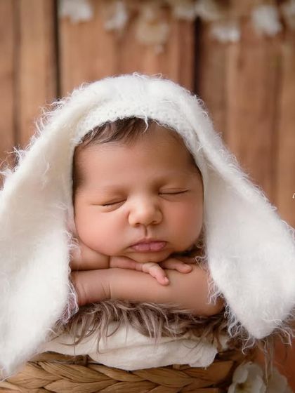 Some bunny is new here! This close-up shot focuses on the adorable face and the soft, fuzzy texture of the bunny ears.