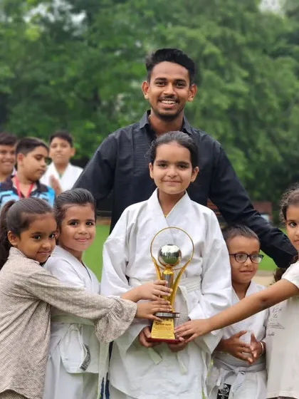 This trophy isn't just metal, it's proof of our collective hard work. I am incredibly proud of my young fighters who hold it high. We win as a family.