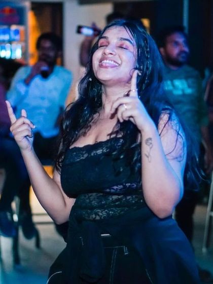 A guest feeling the music, a perfect capture of the night's vibe.