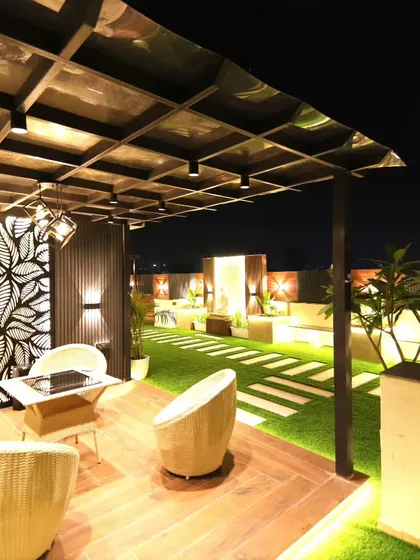 Another view of the stylish pergola, showcasing the combination of wood, metal, and decorative panels.