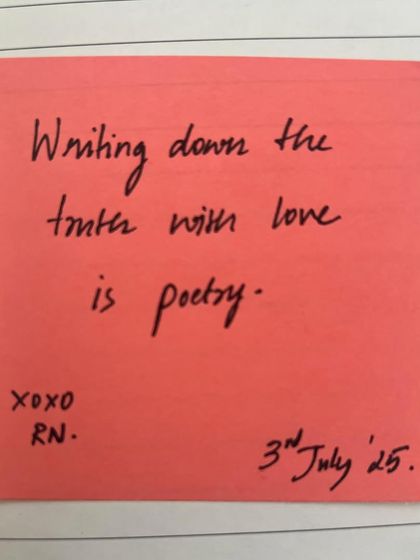 A simple, handwritten note on a sticky pad. 'Writing down the truth with love is poetry.' This is the definition I live by.