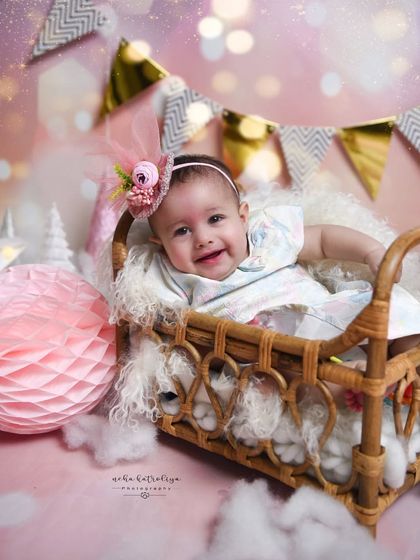 For this part of the session, we switched to a rustic cane basket and a different floral headband. I like to offer a variety of props and looks within a single milestone shoot.