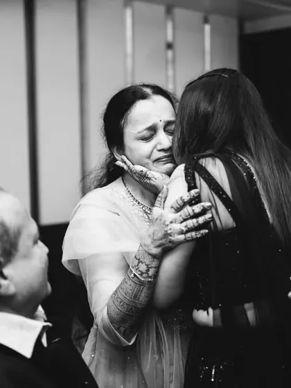 An emotional, heartfelt hug between a bride and her mother. These are the real, unposed moments that hold so much meaning, captured in a timeless black and white frame.