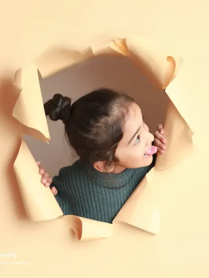 A cheeky tongue-out pose from our paper-tear series. This concept allows for so many fun and expressive portraits.
