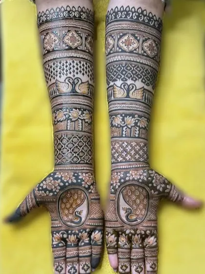 A beautiful design with swans and peacocks.