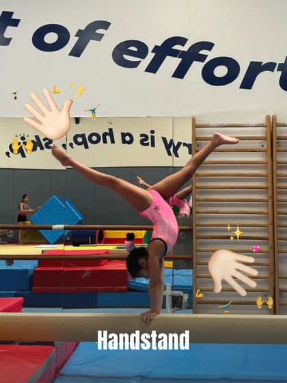 Can you guess the skill? This gymnast is performing a beautiful handstand on the beam.