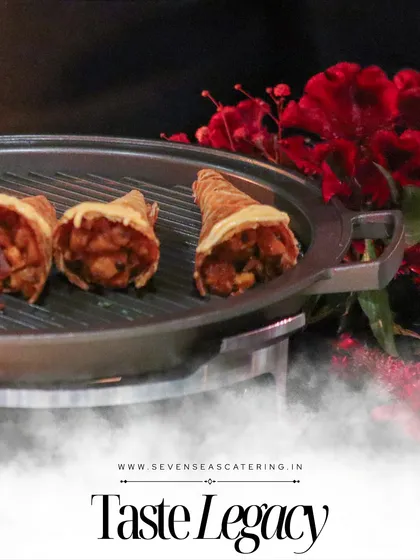 Cones of creativity, filled with flavour and flair. These savoury cones are presented on a grill-style platter, adding a touch of drama to their service.