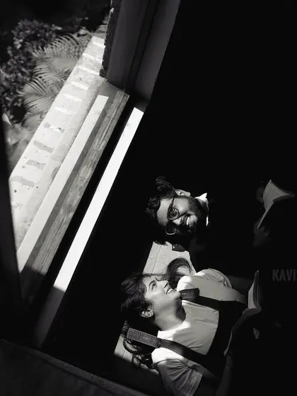A creative overhead shot in black and white, capturing the couple in a unique and artistic way during their pre-wedding session.