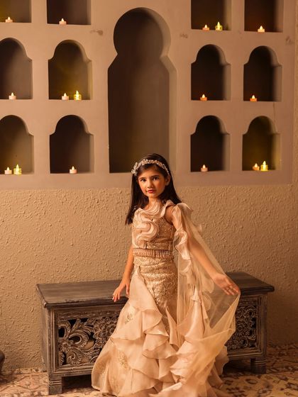 The flowing dupatta and layered ruffles are designed for beautiful movement.