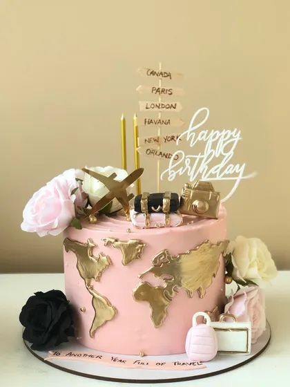 Adventure is out there, and it can be on a cake too. This travel-themed birthday cake features a world map, luggage, and a passport, perfect for the globetrotter in your life.